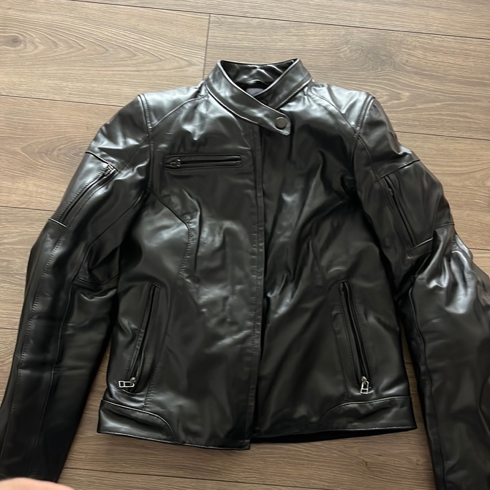 Women’s Black Dianese genuine, leather, motorcycle jacket. Brand new